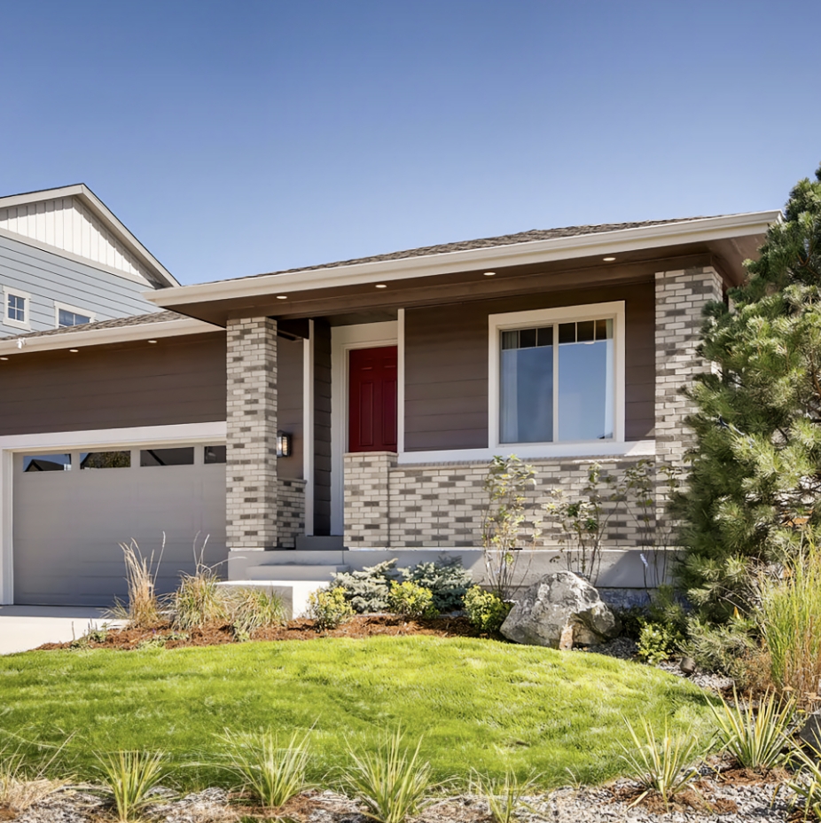 Exterior rendering of a two-story Dream Finders Homes home with deep blue siding and stone front porch