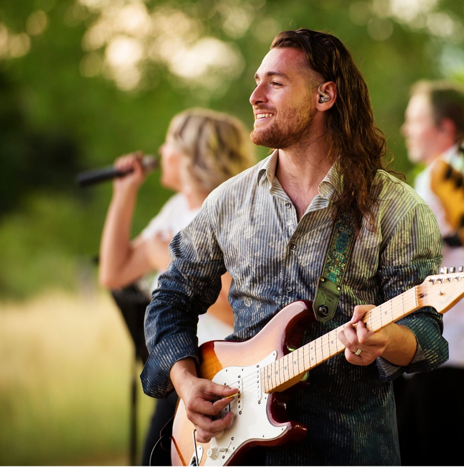 A musician takes the stage at the Budweiser Event Center to perform in front of a crowd of eager listeners