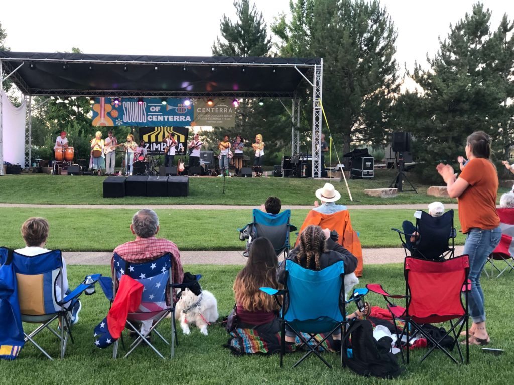 A crowd of locals and strangers alike, gather to listen to the sweet music found at the Sounds of Centerra concert