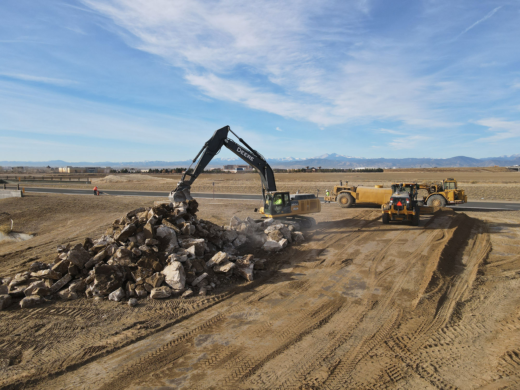 The construction crew breaking down and clearing the land that will become the future Kinston development site