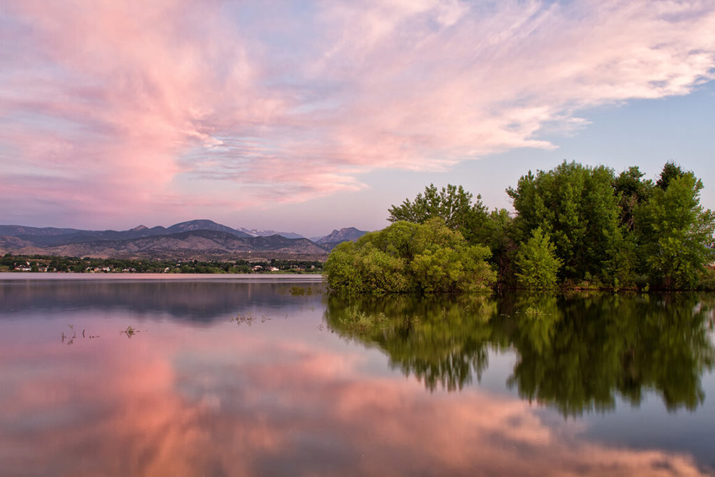 Calming lake at sunset offers a place to relax, fish off the docks or walk along the trail