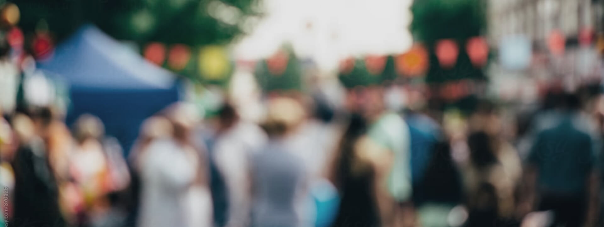 A crowd of people gather for an event in the community