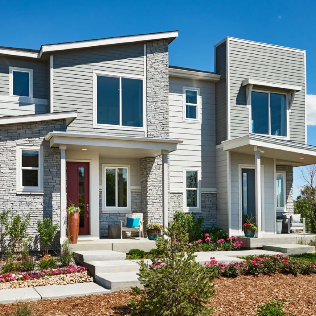 The exterior of a two story home with a front porch.