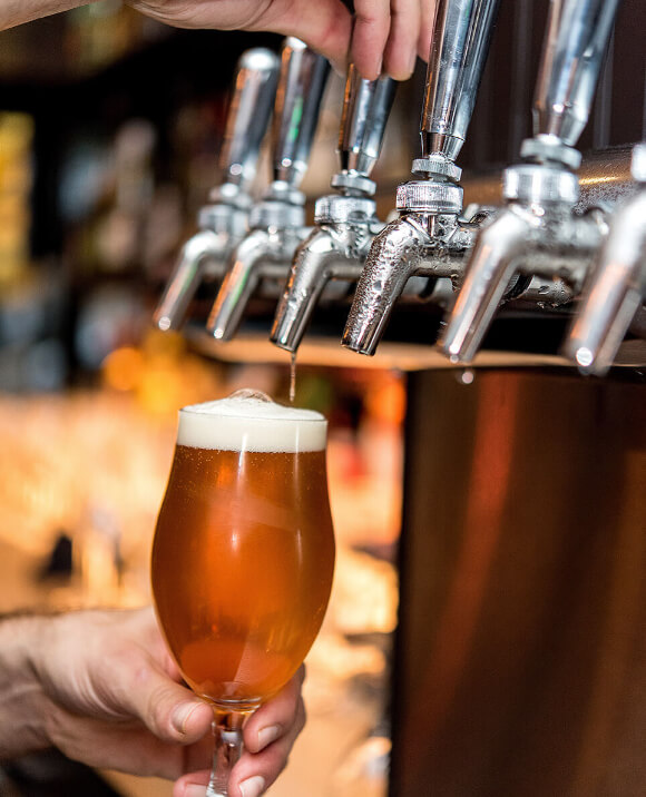 Image of glass being filled with beer