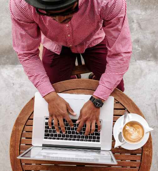 Image of man typing on laptop