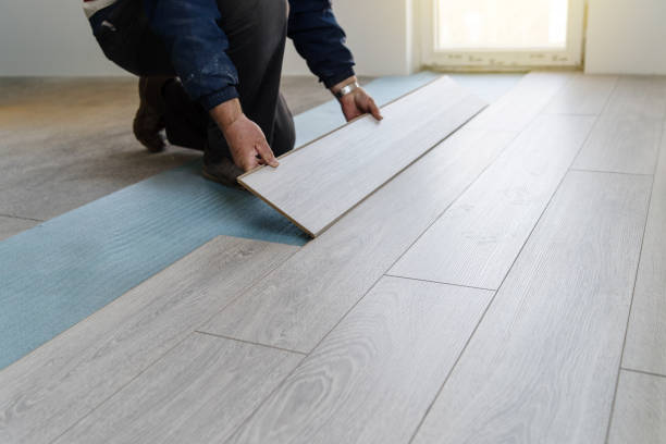 Image of a worker carpenter doing laminate floor work