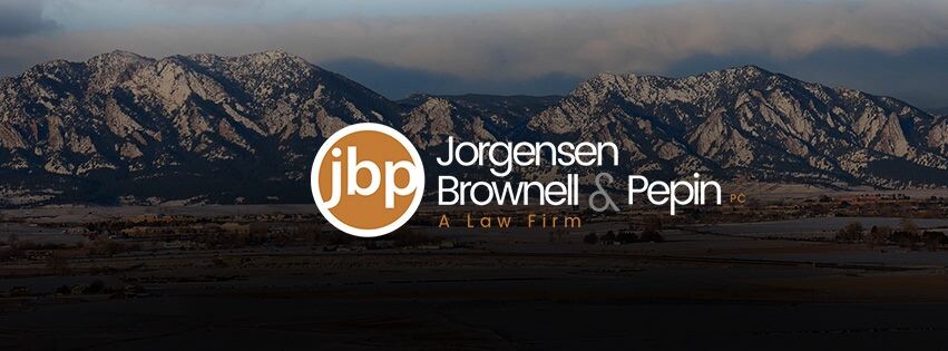 Jorgensen Brownell & Pepin logo with mountains in the background