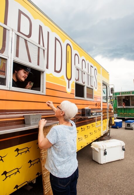 Image of woman ordering at a food truck