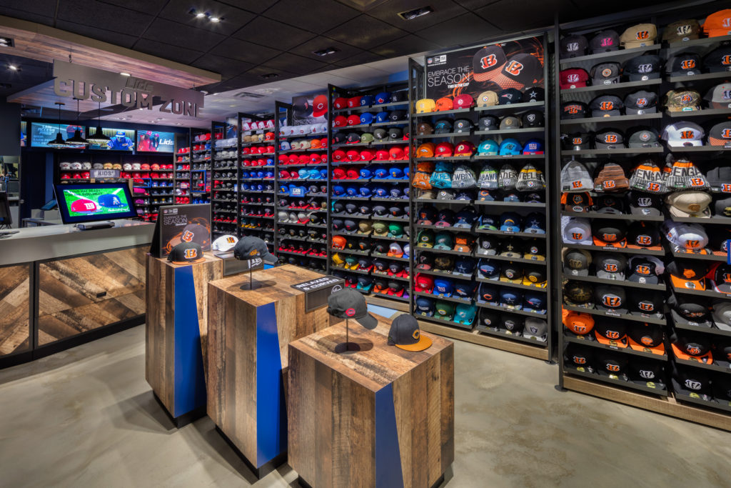 Interior image of a wall of hats at a Lids store