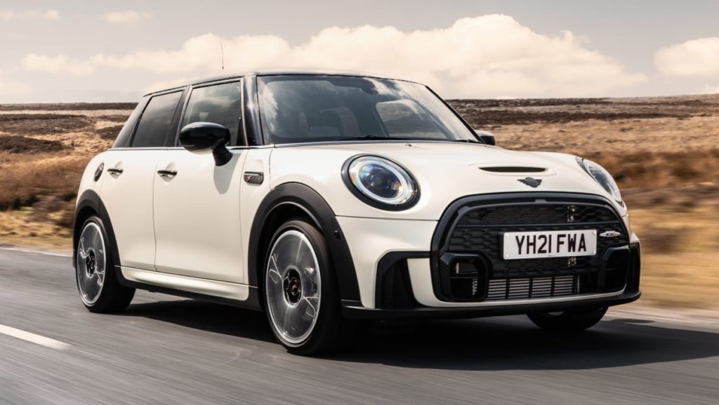 Image of white Mini Cooper driving on road