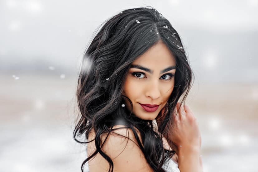 Image of beautiful woman with snowflakes in her hair