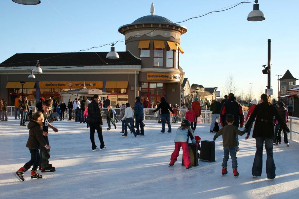 Image of a large group of people ice skating at The Ice Rink Loveland