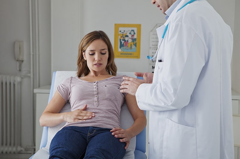 Image of woman being examined by a doctor