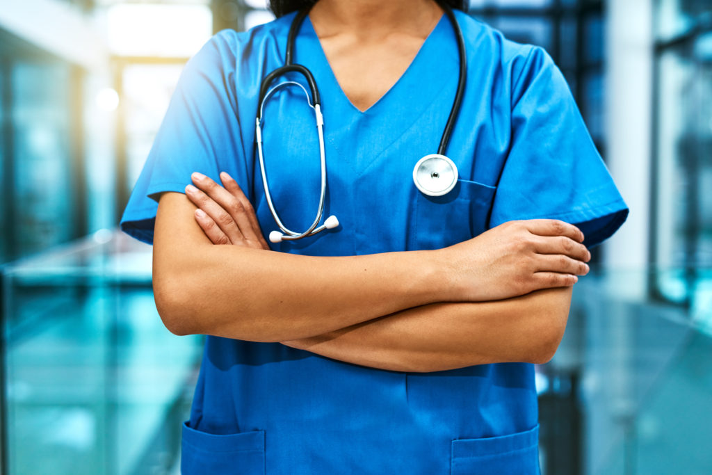 Image of a doctor with arms crossed and a stethoscope around their neck