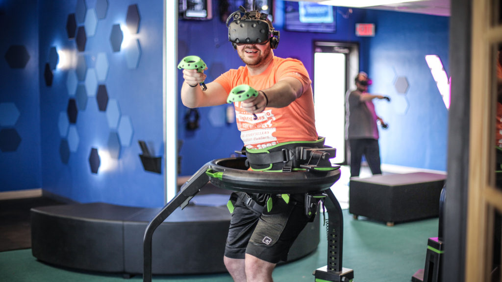 Image of a man playing a VR game at VR Arcade