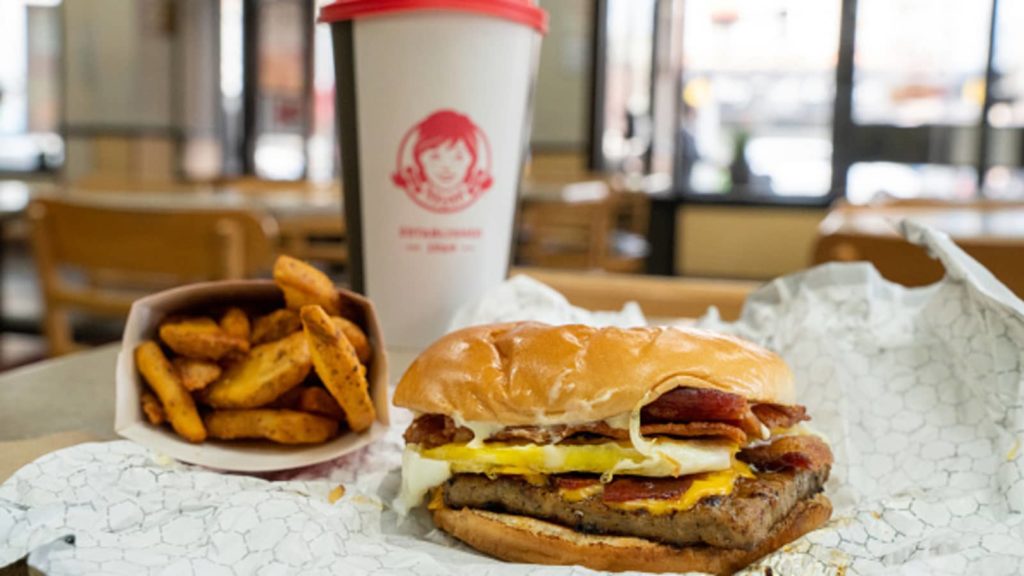 A burger with fries, a cup of coffee, and shopping.