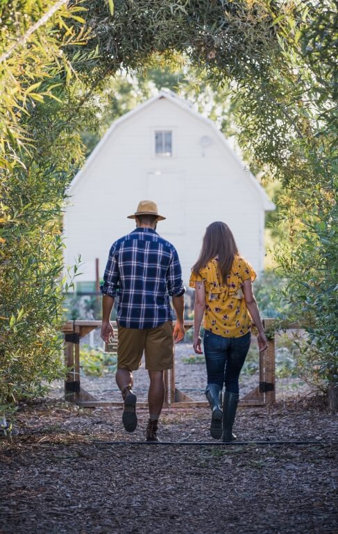 Image of couple walking on trail towards the High Plains environmental center