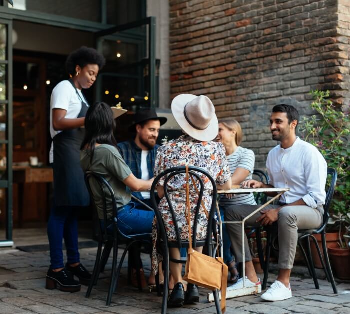 Image of group ordering dinner outside