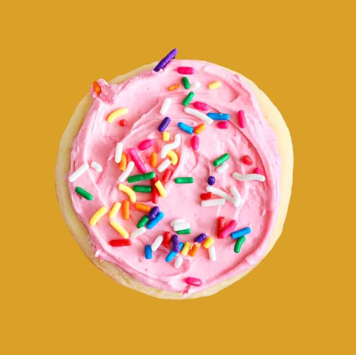 Image of a cookie with pink frosting and sprinkles