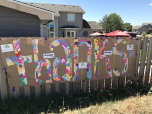 A mural that says thanks for charity support at Centerra