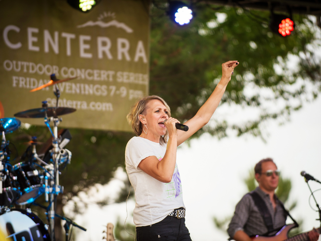 woman on stage at sounds of centerra