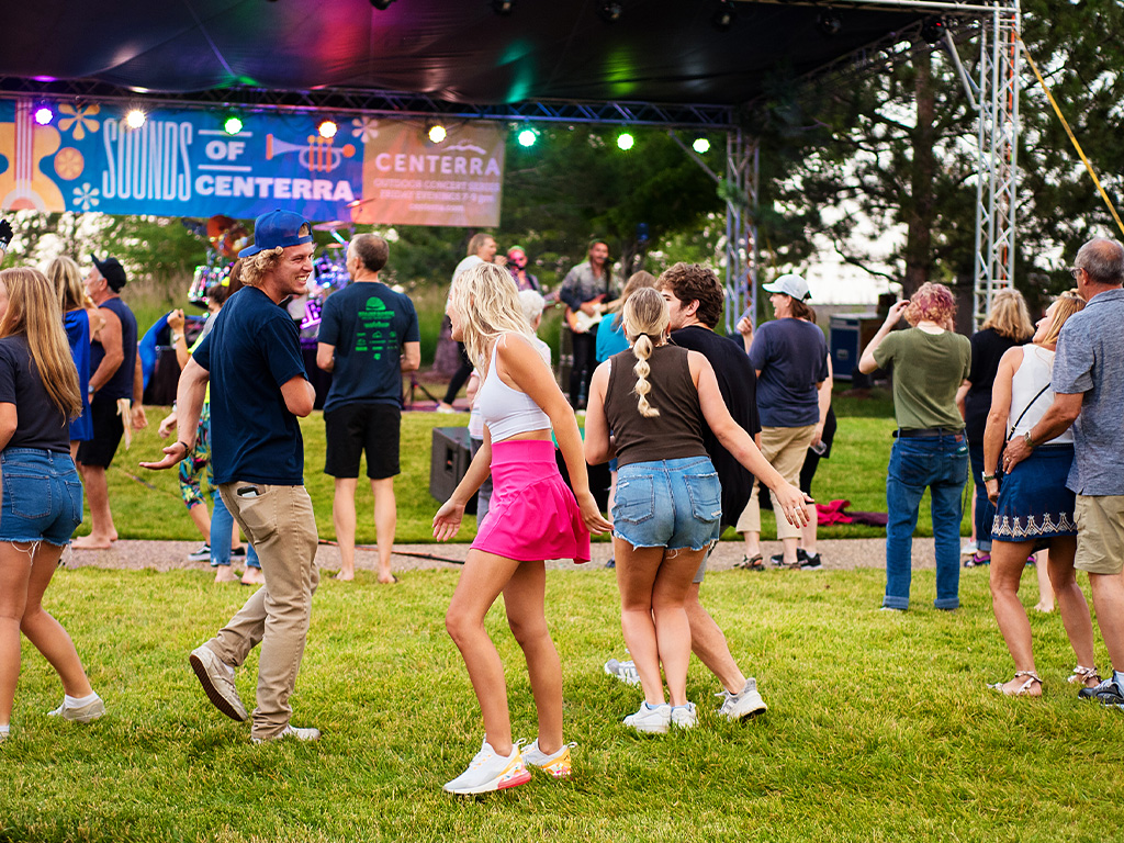 couples young and old dancing at Sounds of Centerra concert