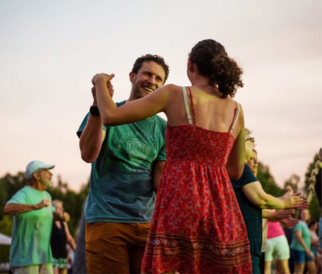 A man and woman enjoying a Certified Wild dance at a festival in Loveland.