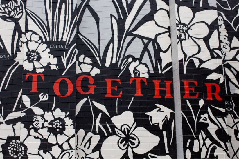 A black and white mural with the word "together" on it, perfect for new homes or shopping areas.
