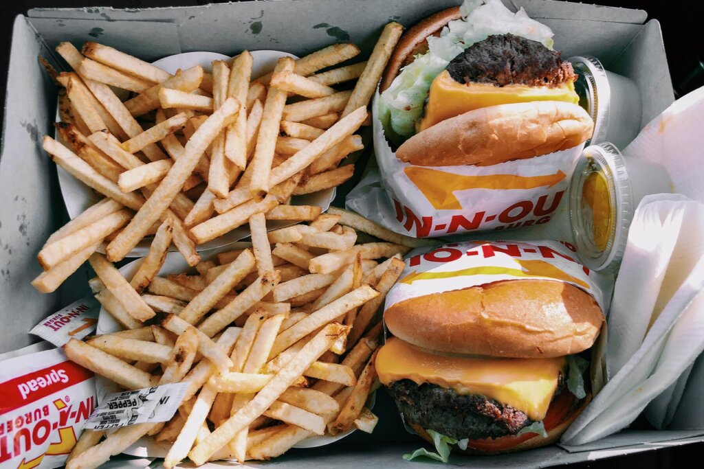 two in-n-out burgers and fries