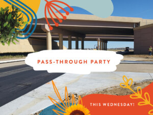 A newly paved road passes under an overpass with two workers nearby in Centerra, Loveland Colorado. Decorative graphics and text read "PASS-THROUGH PARTY THIS WEDNESDAY! Exciting new homes coming soon.