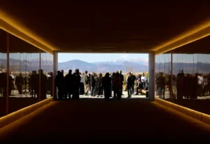 people gathering at a new bus station called the centerra loveland station framing the rocky mountains