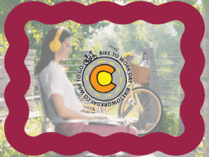 A woman wearing yellow headphones sits outdoors with a bicycle parked nearby in Centerra, Loveland Colorado; a "Bike to Work Day" logo is centered over the image with a wavy maroon border.